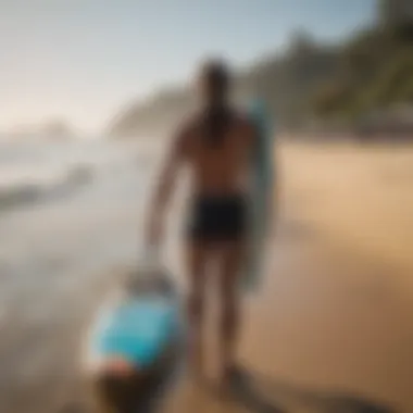 Surfer using surfboard carry strap for convenience