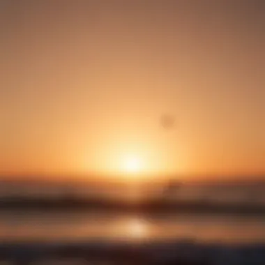 Silhouetted kitesurfers against a stunning Sicilian sunset