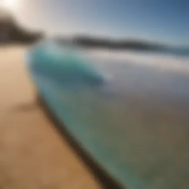 Sleek Skimboard resting on golden sandy beach with azure ocean in the background