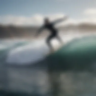 Surfer with soft top board catching a wave