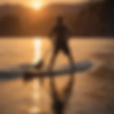 Sunset silhouette of a paddle boarder