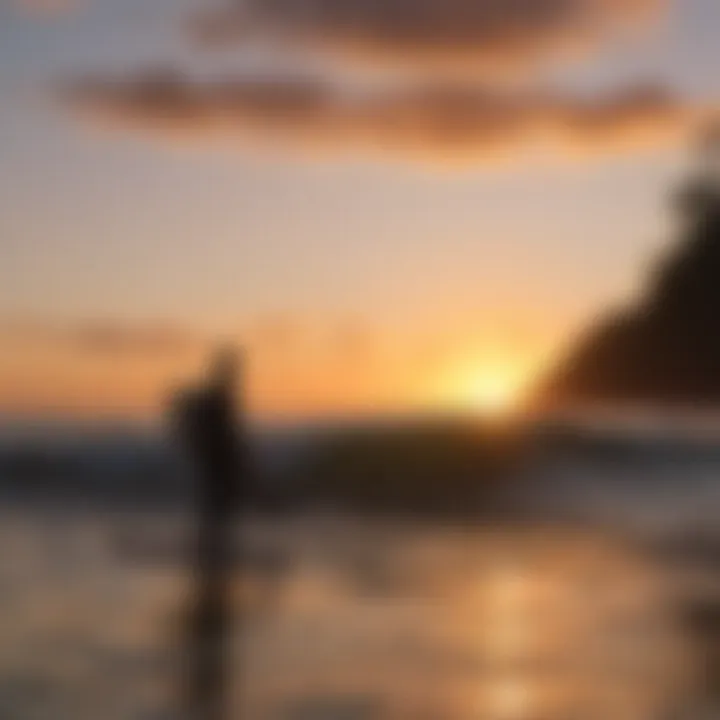 Sunset silhouette of a surfer at Playa Manuel Antonio in Quepos, Costa Rica