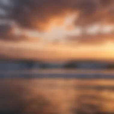 Stunning sunset backdrop with surfers silhouetted against the horizon