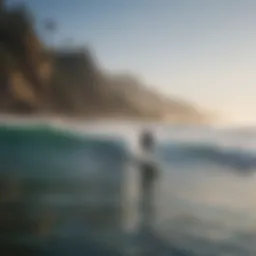 Majestic California coastline with surfers riding waves