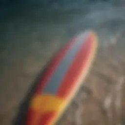 A close-up view of a vibrant surface surfboard showcasing its unique graphics and design elements.