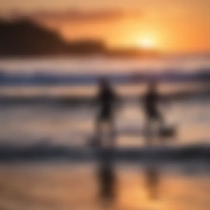 Surfers silhouetted against the vibrant hues of a sunset on the North Shore