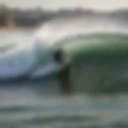 Surfer catching a wave at Carcavelos Beach