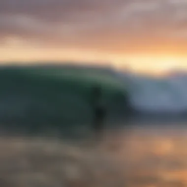 Sunset silhouette of a surfer at Point Addis