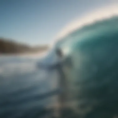 Surfer carving through the waves at a New Zealand beach