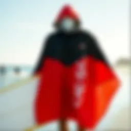 Stylish surfing poncho displayed against a beach backdrop