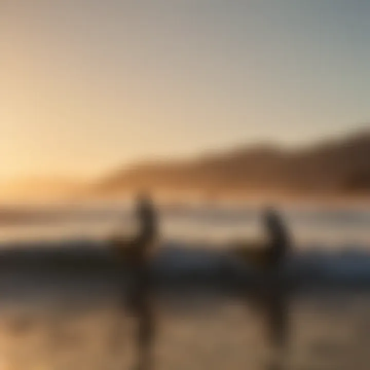 Sunset silhouette of surfers at Surfrider Beach in Malibu