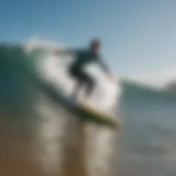 Surfer riding a wave at Surfrider Beach in Malibu