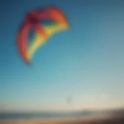 A vibrant duotone kite soaring against a clear blue sky