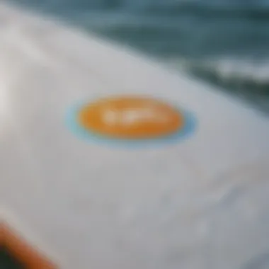 Close-up of a surfboard logo symbolizing personal identity and values.