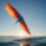 Aerodynamic kite soaring against a clear blue sky