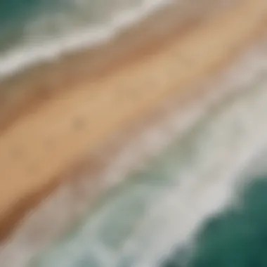 An aerial view of a vibrant beach filled with surfers enjoying the waves