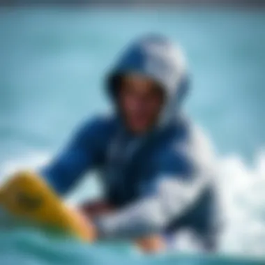 Athlete in Action with the Billabong Grey Hoodie An athlete wearing the Billabong grey hoodie during a watersport activity