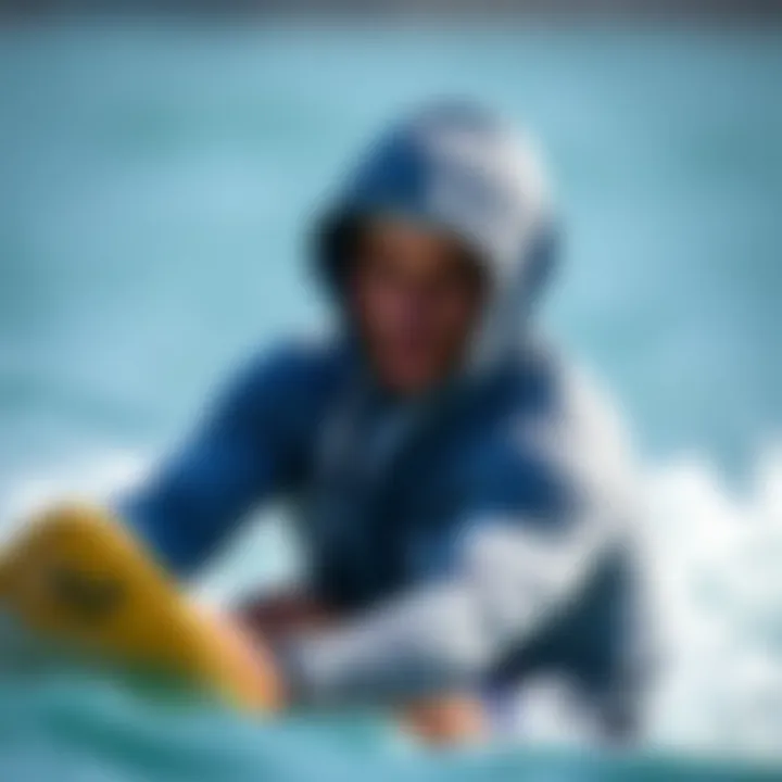 Athlete in Action with the Billabong Grey Hoodie An athlete wearing the Billabong grey hoodie during a watersport activity