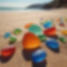 A collection of colorful sea glass pieces glimmering in the sunlight on a sandy beach.