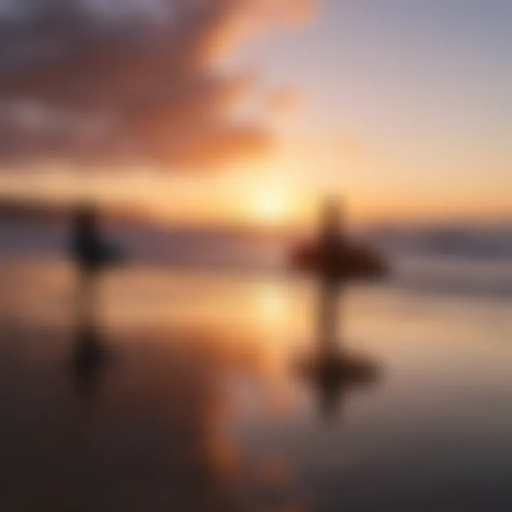 Sunset silhouette of surfers at Torquay Beach