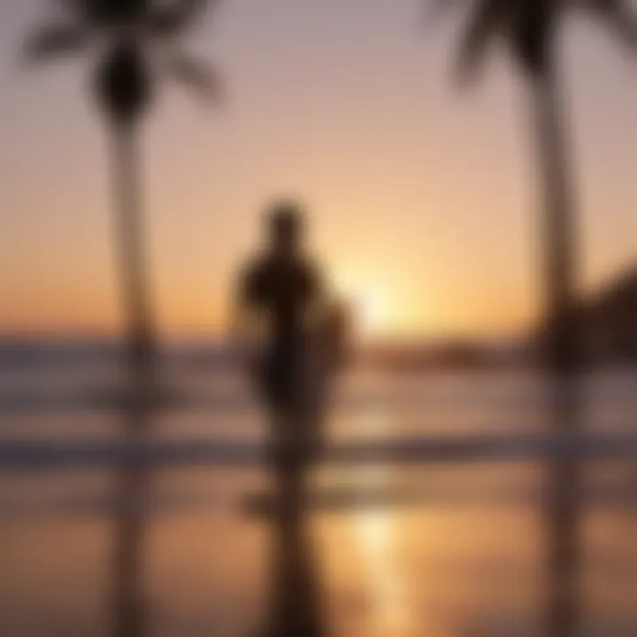 Sunset silhouette of a surfer with a surfboard on a Mexican beach