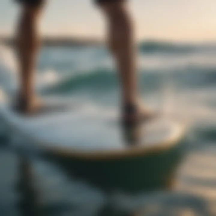 Person using Dakine pad on a surfboard