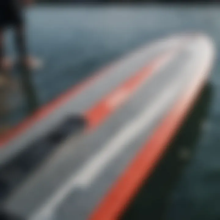 Close-up of wakeboarding gear including a surfboard