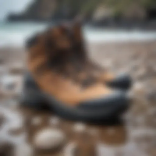 Stylish Xcel Drylock booties displayed on a rocky shore